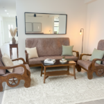 Handcrafted Teak Wood 5-Seater Sofa Set with Intricate Wheel Carvings